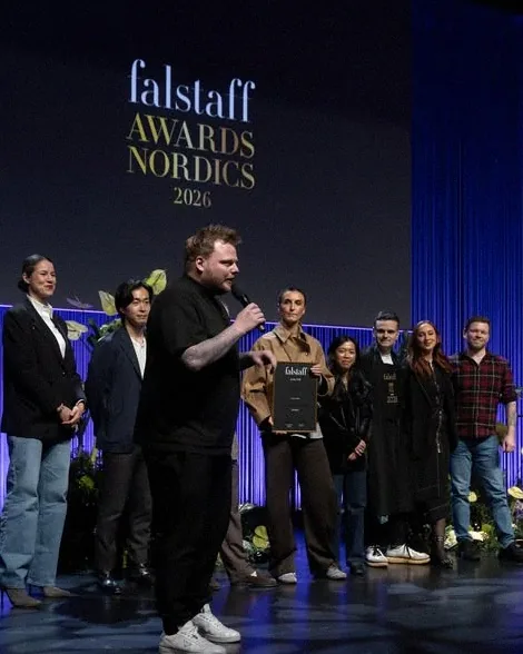 Rasmus Munk on stage accepting an award