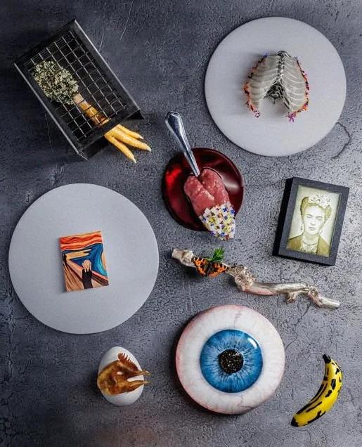 An overhead flatlay of several Alchemist courses arranged together