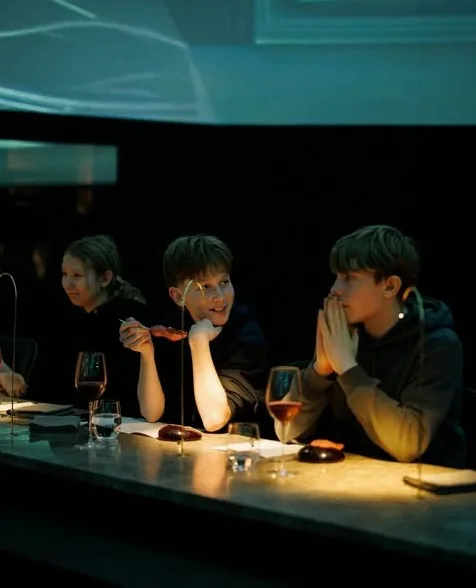 Guests seated at a table during the dining experience
